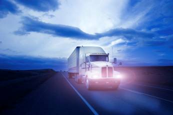 a truck staying withing the boundaries of its lane